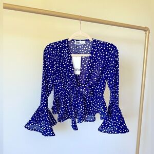 Fully flared top, navy blue with white dots. It ties on the front, never used.